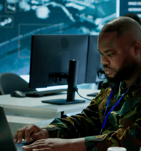 A DTP specialist preserves layout on a defense proposal, using Military Translation Services so confidential formatting.