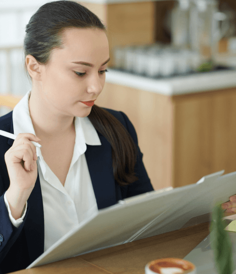 A linguist checks a medical term glossary while Georgian translation services standardize specialized terminology.