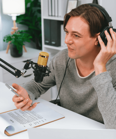 A voice actor records a swift phone greeting in a studio, delivering Telephone Voiceover Services fast for businesses.