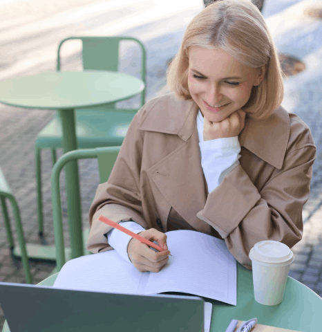 A QA reviewer marks changes on a bilingual proof, as Latvian translation services support diverse audiences with 99%.