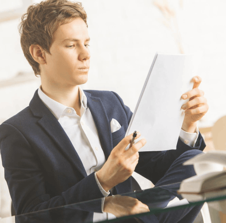 A translator compares a product manual and CAD diagram as Bosnian translation services keep technical terms accurate.