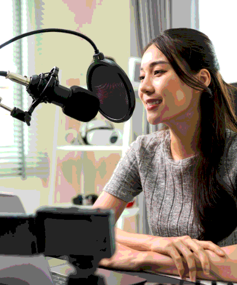 An audio engineer checks a technical glossary while Tagalog Voice Over Services record complex terms with precise timing.
