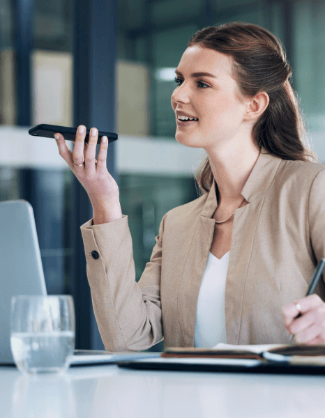 A customer listens to clear IVR prompts on a smartphone, showing caller experience improvements from Telephone Voiceover.