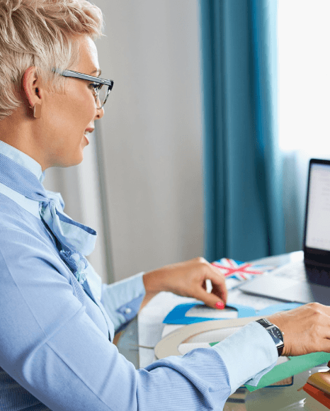 A web editor reviews a Polish webpage beside the English version as Polish Translation Services handle Polish-to-English.