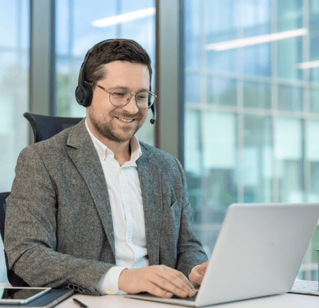 A linguist verifies a transcript and security checklist, showing why government transcription services are trusted.