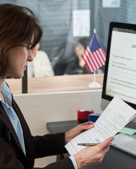 A translator zooms in on seals and annotations during Birth Certificate Translation services in New York for USCIS filing.