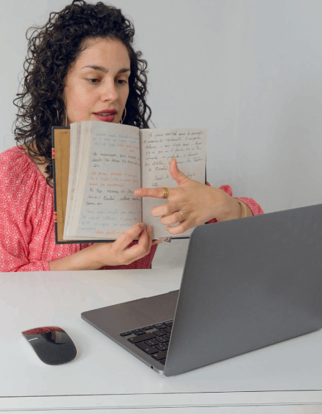 A linguist proofreads a draft using newsletter translation services for varied audiences, flagging tone and style issues.