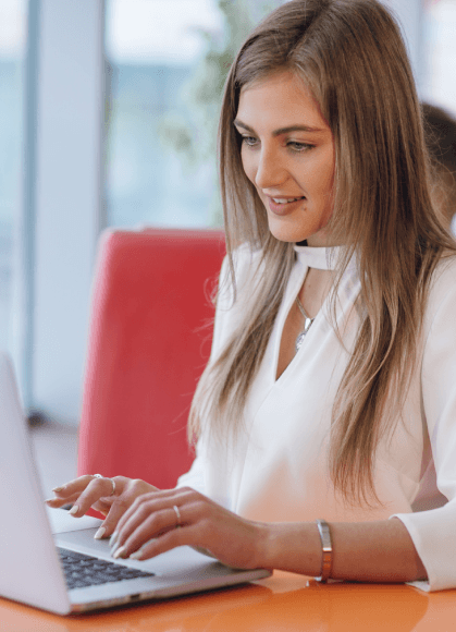 A client reviews a typed draft on a laptop during a video call as Manuscript Typing Services deliver virtual online support.