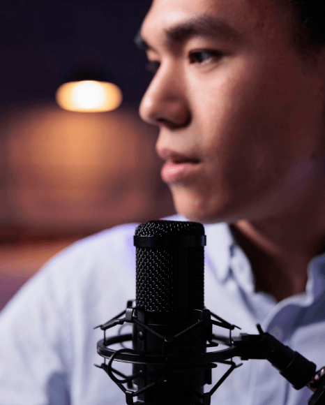 A voice talent records multiple voice style passes as Deep Voiceover Services capture serious, smooth, and rich-toned reads.