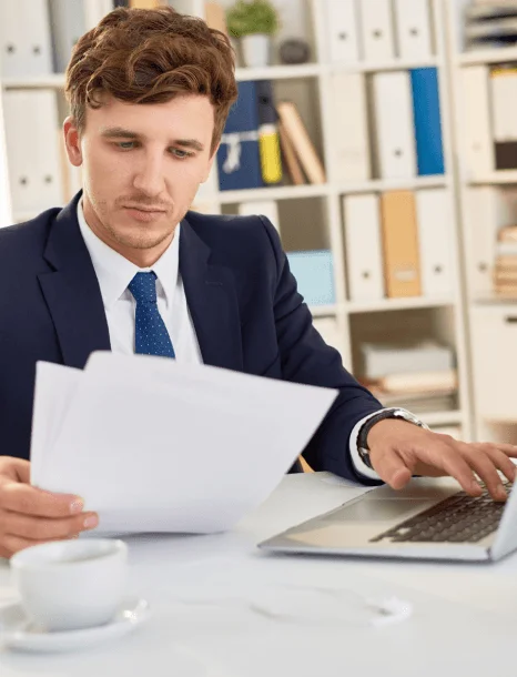 A localization specialist edits website navigation text as Quick Translation Services adapts wording for U.S. users.