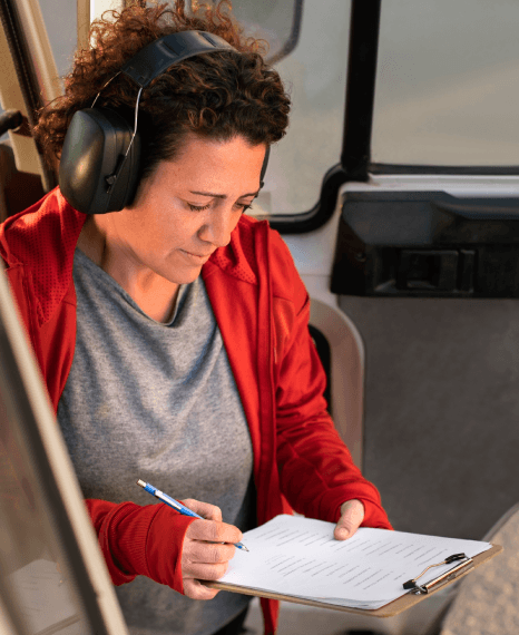 A supplier, dealer, and OEM team reviews manuals and contracts, using automotive translation services for global rollout.