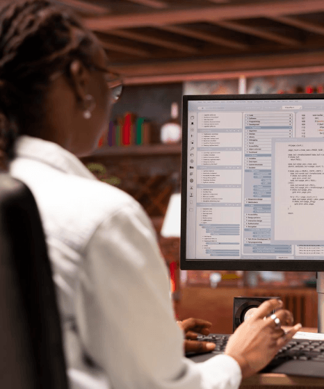 A project manager tracks sdh subtitling services for industry clients, checking deadlines across five sectors on a board.