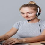 A person working on media content to deliver audio-descriptive