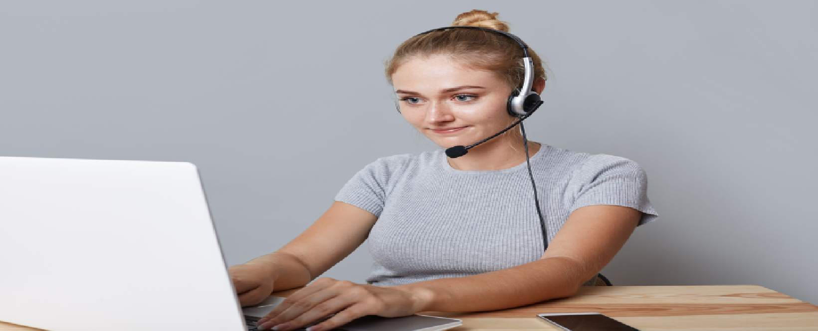 A person working on media content to deliver audio-descriptive