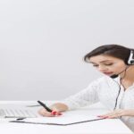 A person working to deliver high-quality audio description services at an affordable rate