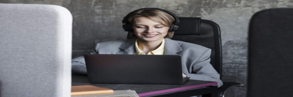 A person working on a laptop to create a substitle at an affordable price