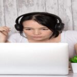 A person working on video to create high-accuracy subtiling for an affordable rate