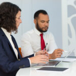 Team of expert captioners working on video captioning project.