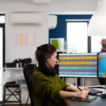 A person working on video to create a video subtitling