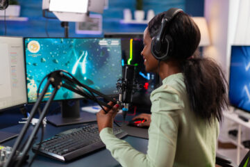 A young woman working on streaming viral video game in role of voice-over