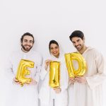 Eid al-fitr concept with friends showing letters