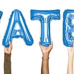 Hands showing water balloons word