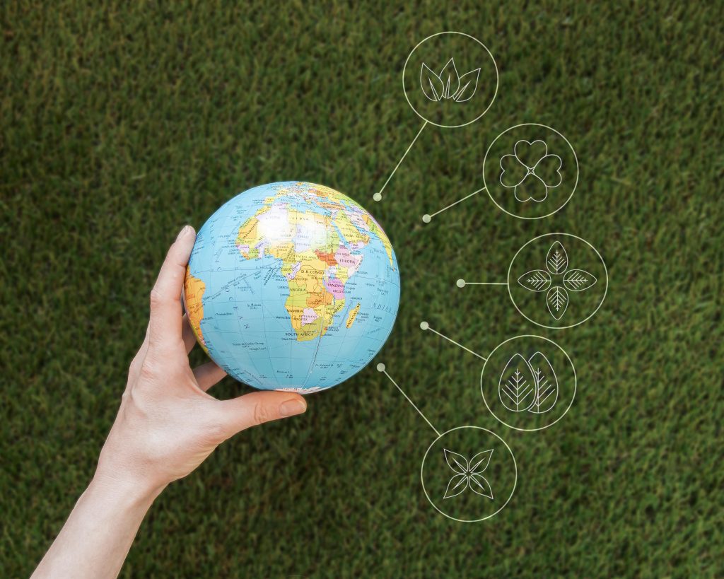 Close up woman holding earth globe