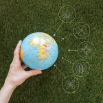Close up woman holding earth globe