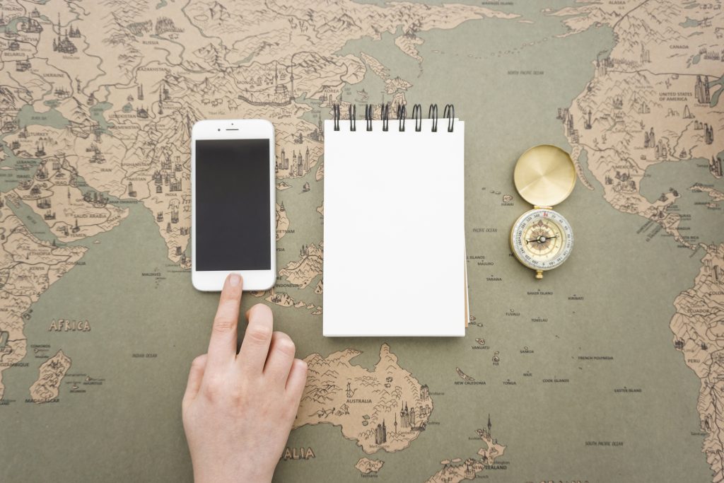 Stories and books traveling across a world map representing how translation helps great stories journey farther globally