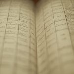 Soft focus of an old book of local records with list of residents' names and information