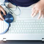 Medical transcriptionist ensuring accuracy while typing patient records for NYC healthcare providers documentation