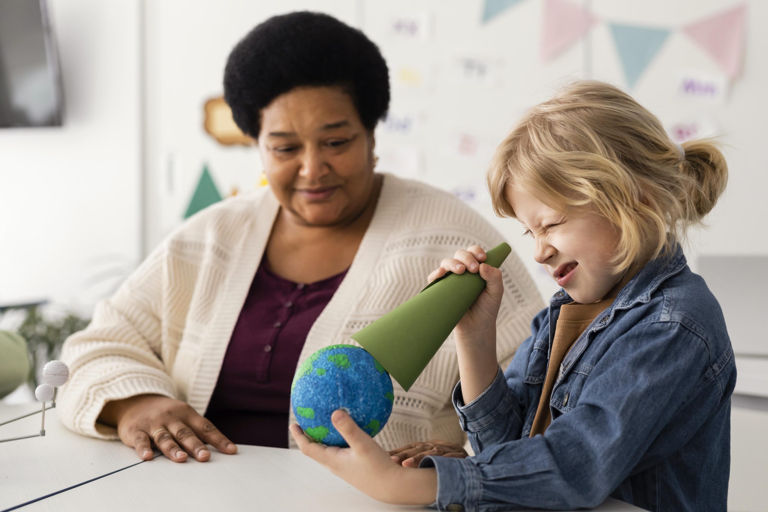 Kids learning about planets in classroom