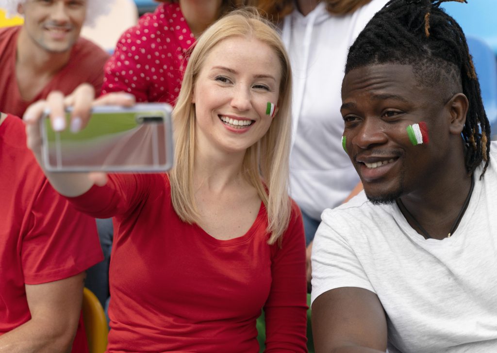 People taking a selfie at a football game