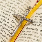 Close-up necklace cross and holy book