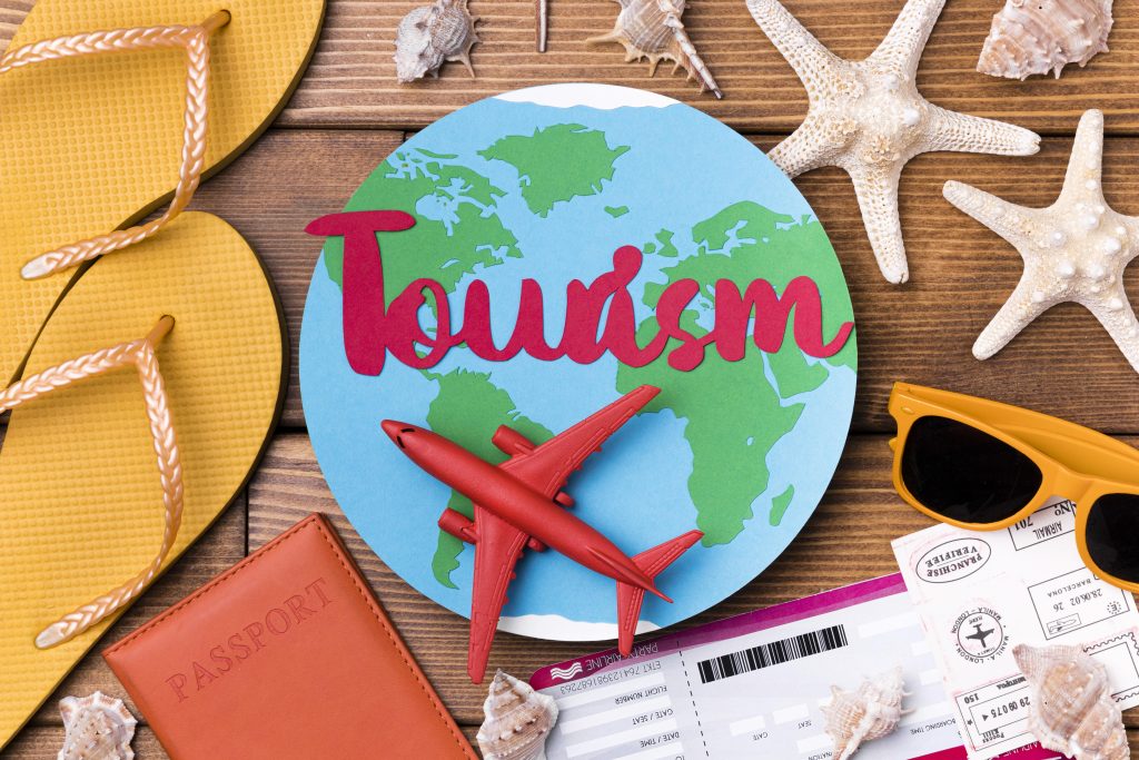 Top view world tourism day with lettering