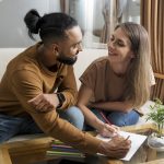 Couple drawing together while digital detoxing