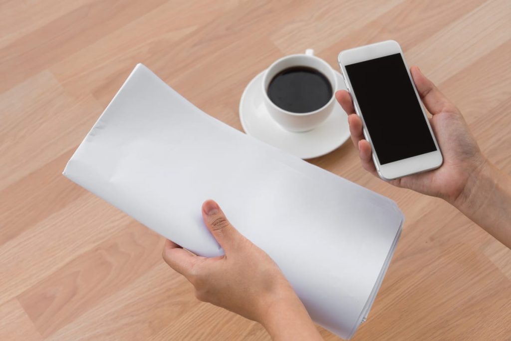 A phone showing a delivered translation email on a Monday morning next to a coffee cup and a printed three-page document - Real Story: A Saturday-Night featured image