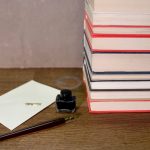 A lawyer's desk with a legal pad, a stamped summons and a Thai-language translation set side by side - Real Story: Translating a featured image