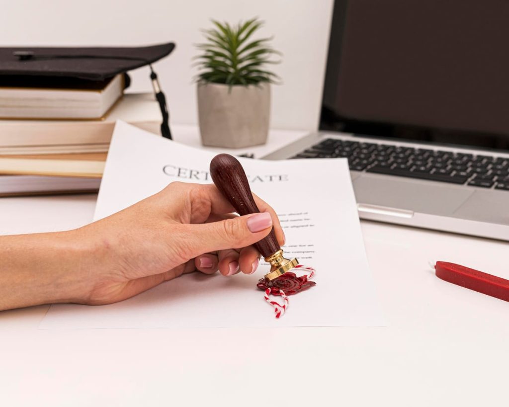 A birth certificate beside its Spanish translation and a notary stamp on an office desk - Real Story: A Birth featured image
