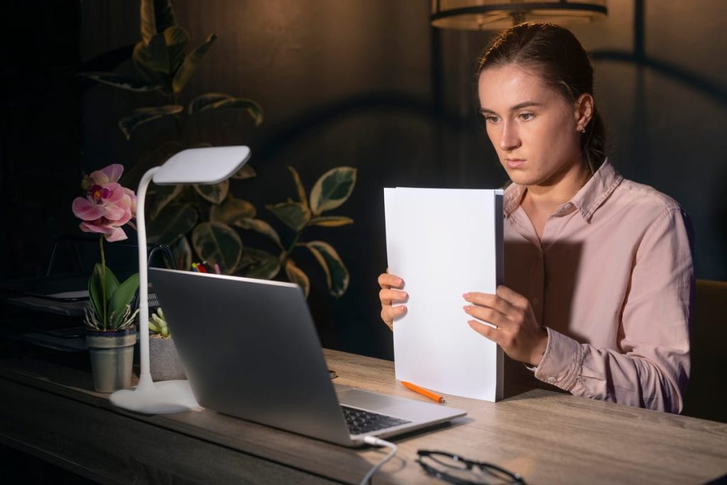 A vital records form on a desk under a lamp in the evening, beside a printed French translation and a signed certificate - Real Story: A Death featured image