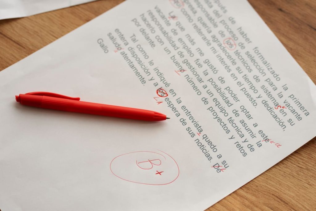 A handwritten legal draft covered in margin corrections lying beside a cleanly typed page on a desk - Real Story: Handwritten Estate featured image