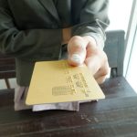 A single-page Cyrillic residence extract with an official stamp, lying beside a phone and a notepad with letters written out one by one - Real Story: Spelling It featured image