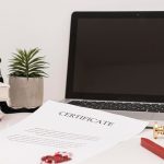 Two French civil registry certificates side by side with a typed English translation and a notary page on a desk - Real Story: Two French featured image